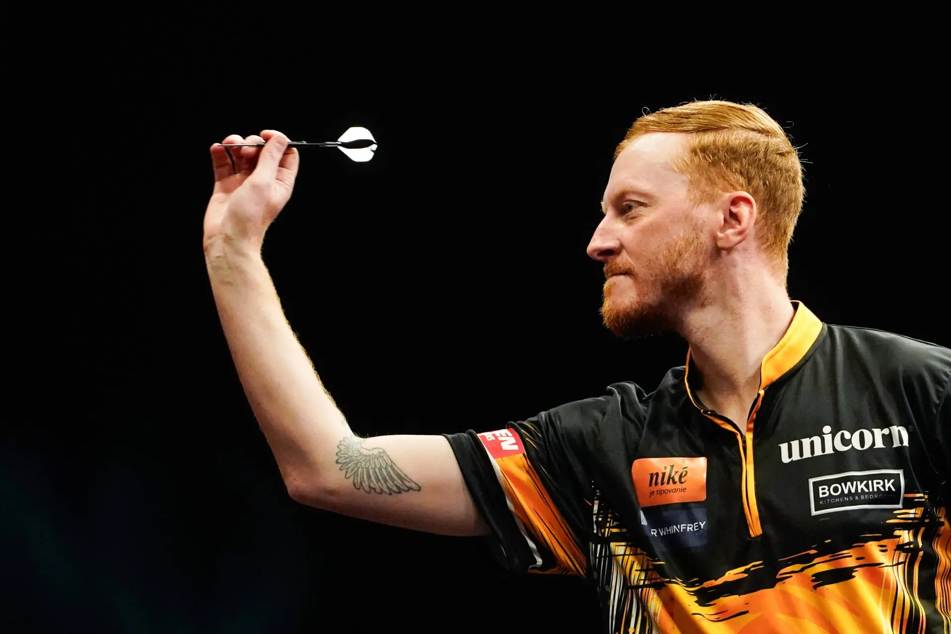 Tom Sykes throws dart.