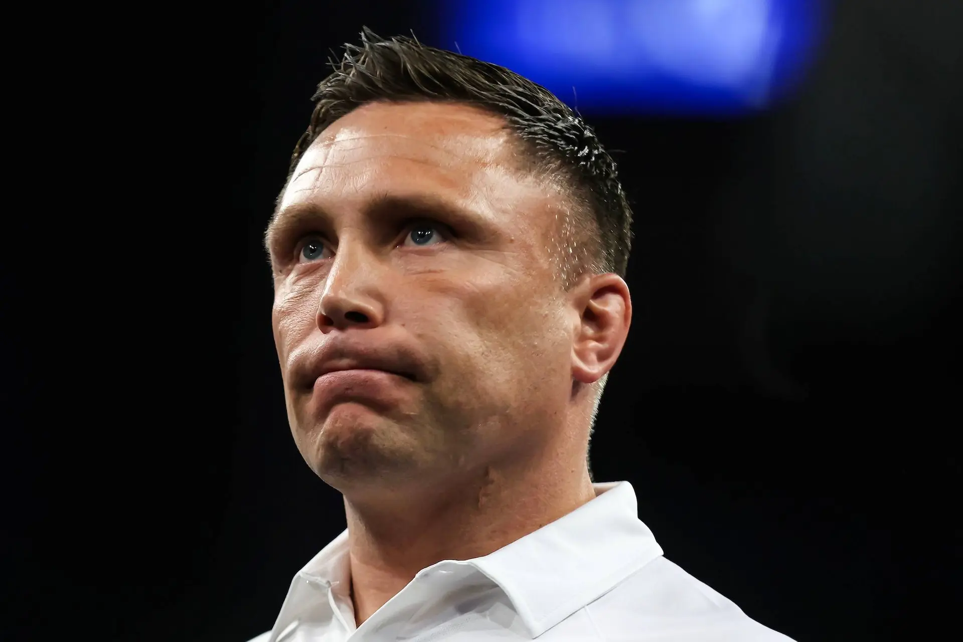 Gerwyn Price struggles on stage.