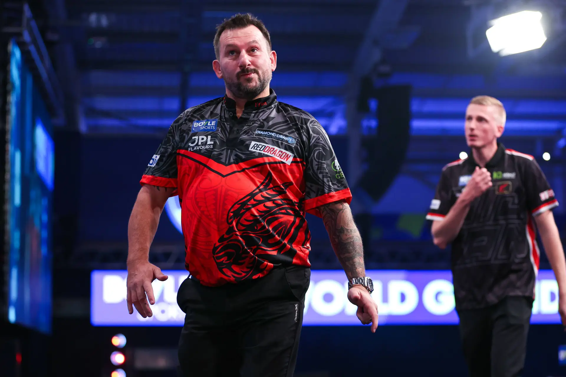 Jonny Clayton and Wessel Nijman head off stage at the 2026 World Grand Prix