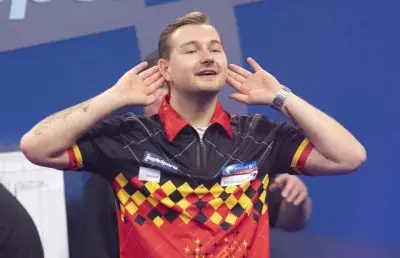 Van den Bergh claims straight sets win over Smith to begin World Grand Prix campaign