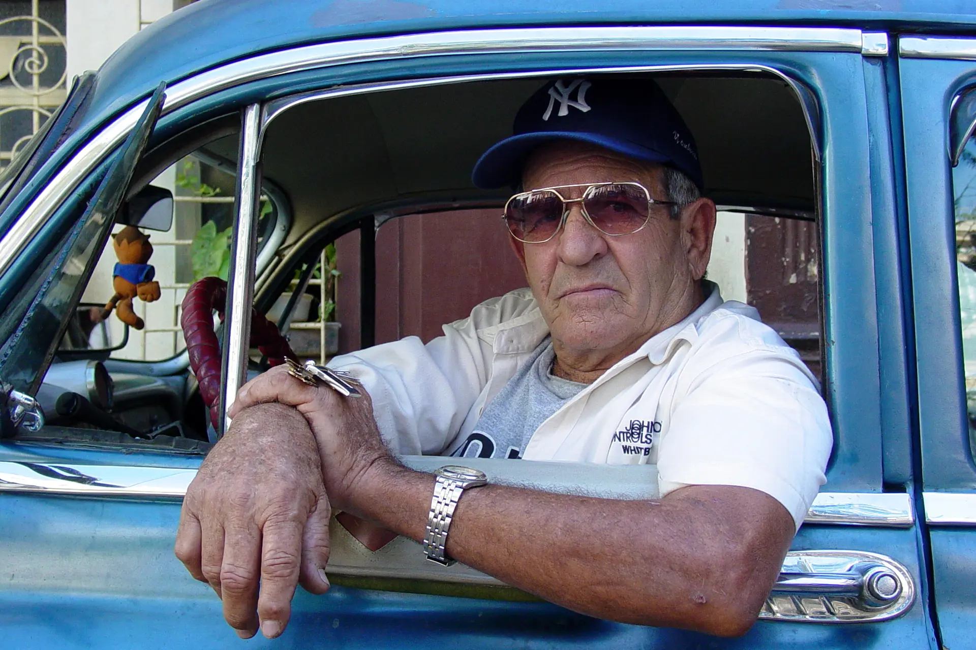 taxi driver in classic car habana vieja havana cuba