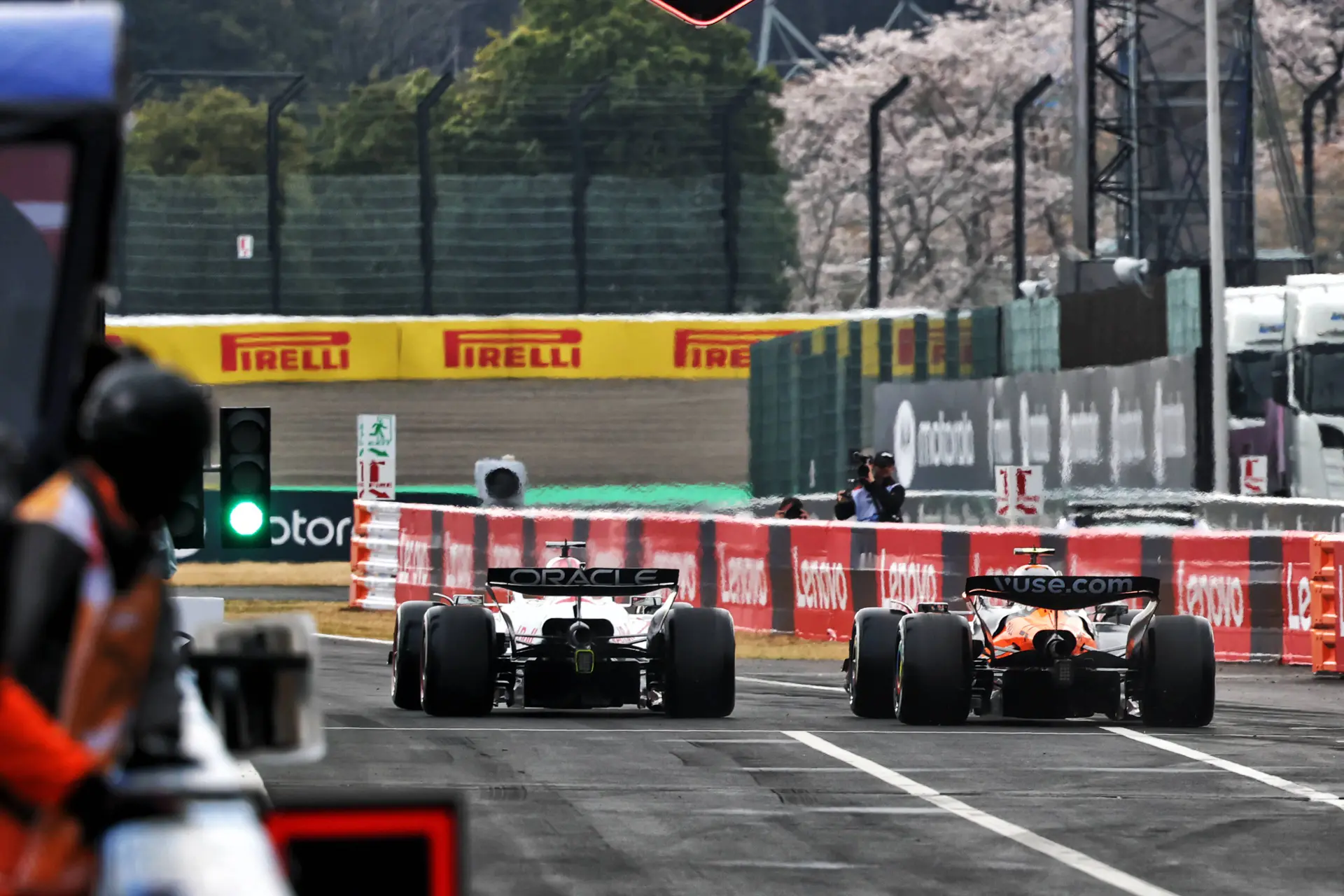 Verstappen and Norris nearly collide on the pit exit!
