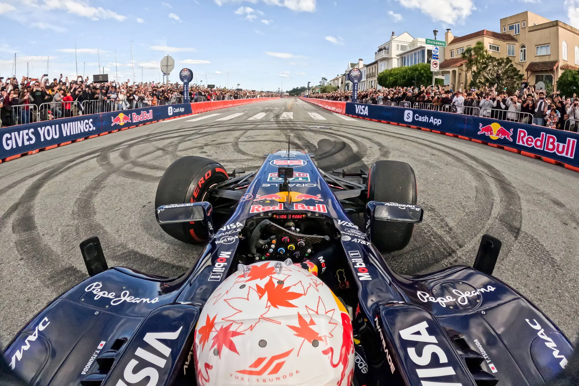 Scary moment for Tsunoda as Red Bull car catches fire in front of crowd