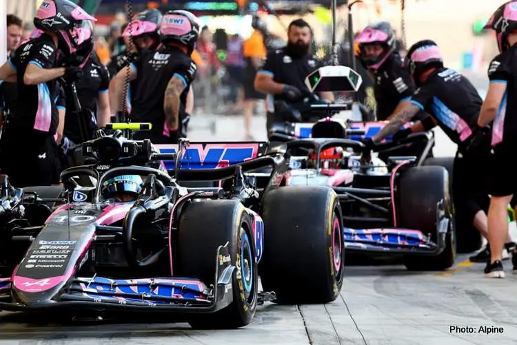 alpine drivers pull into pits 002