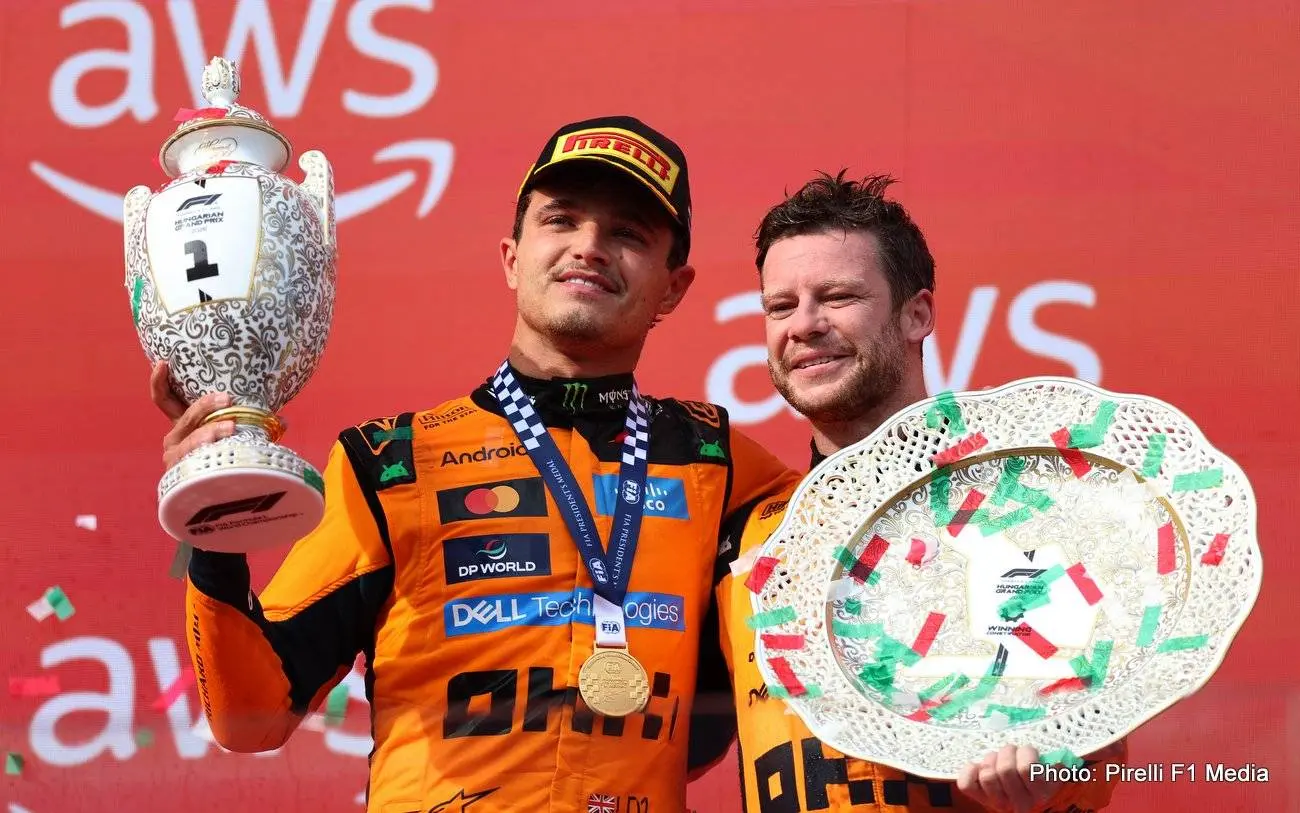 BUDAPEST, HUNGARY - JULY 26: Race winner Lando Norris of Great Britain and McLaren celebrates on the podium with his teammate during the F1 Grand Prix of Hungary at Hungaroring on July 26, 2026 in Budapest, Hungary. (Photo by Alastair Staley/LAT Images)