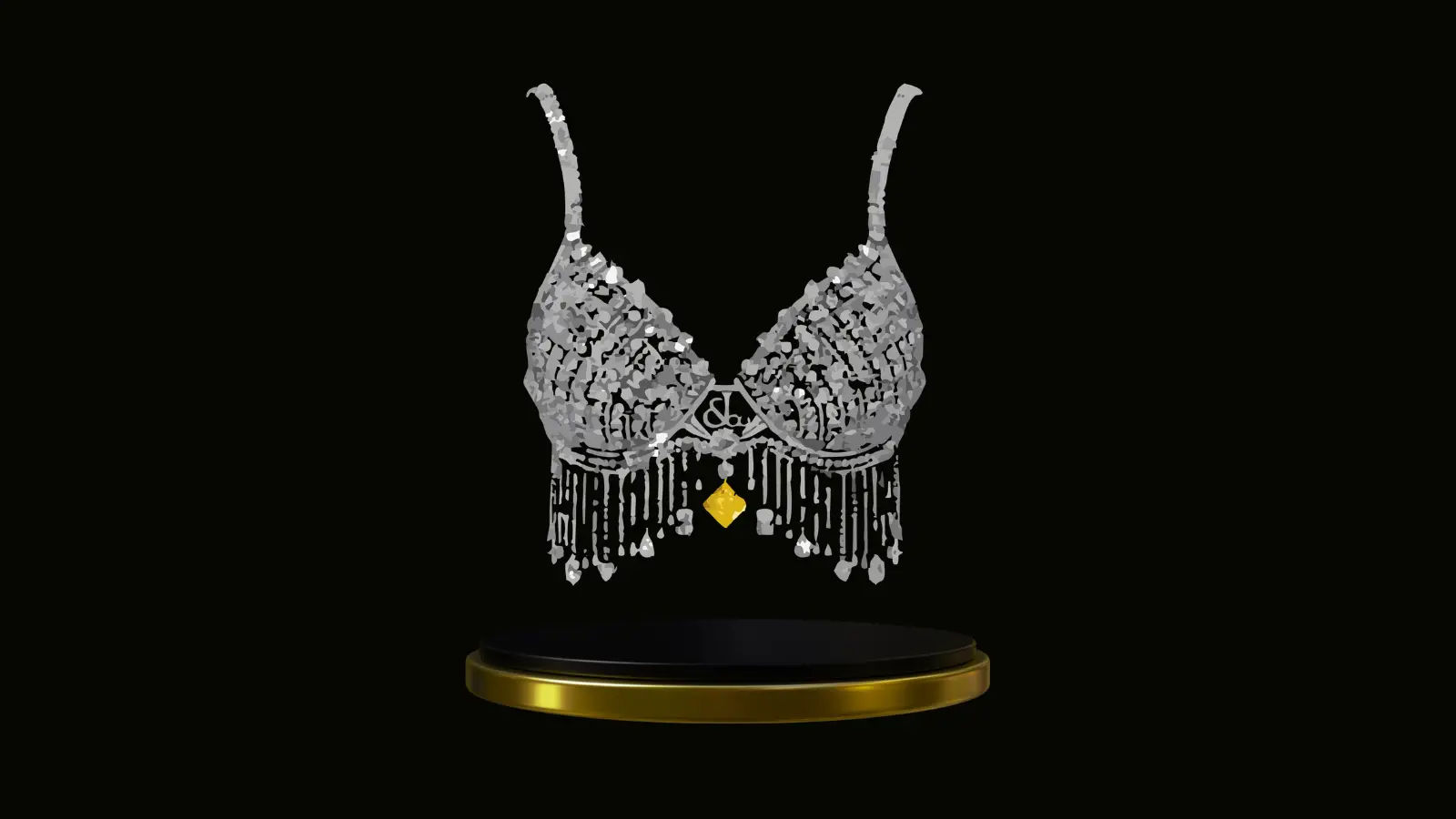 Diamond-encrusted bra with  silver detailing and a gold pendant, displayed above a black and gold pedestal.