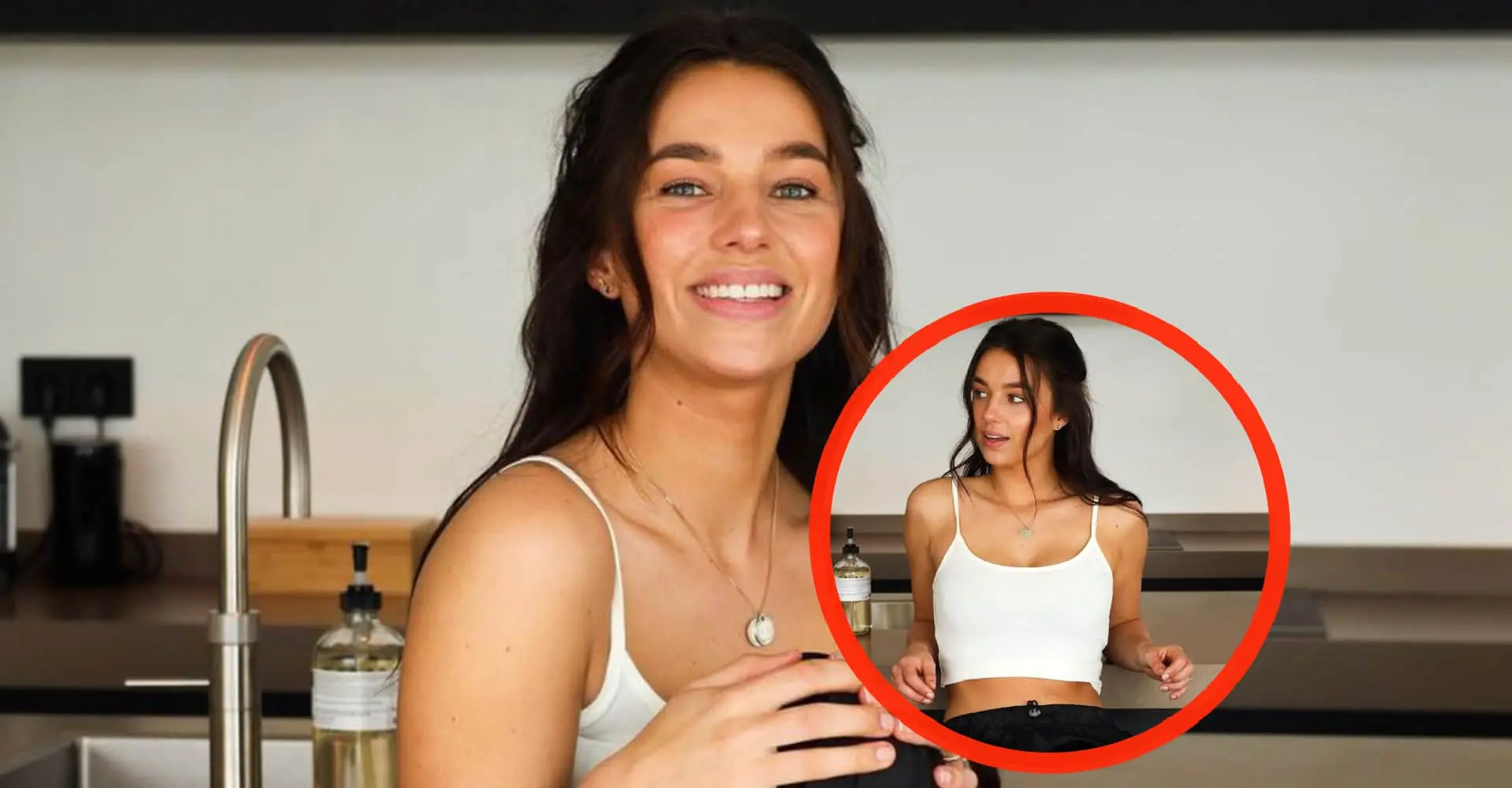 foto luchtig geklede nina warink hangt verleidelijk over het aanrecht