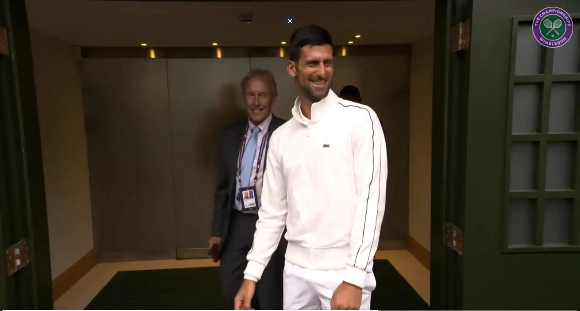 (VIDEO) "Blow... we need everybody to help": Djokovic jokes as he attempts to help dry Centre Court at Wimbledon
