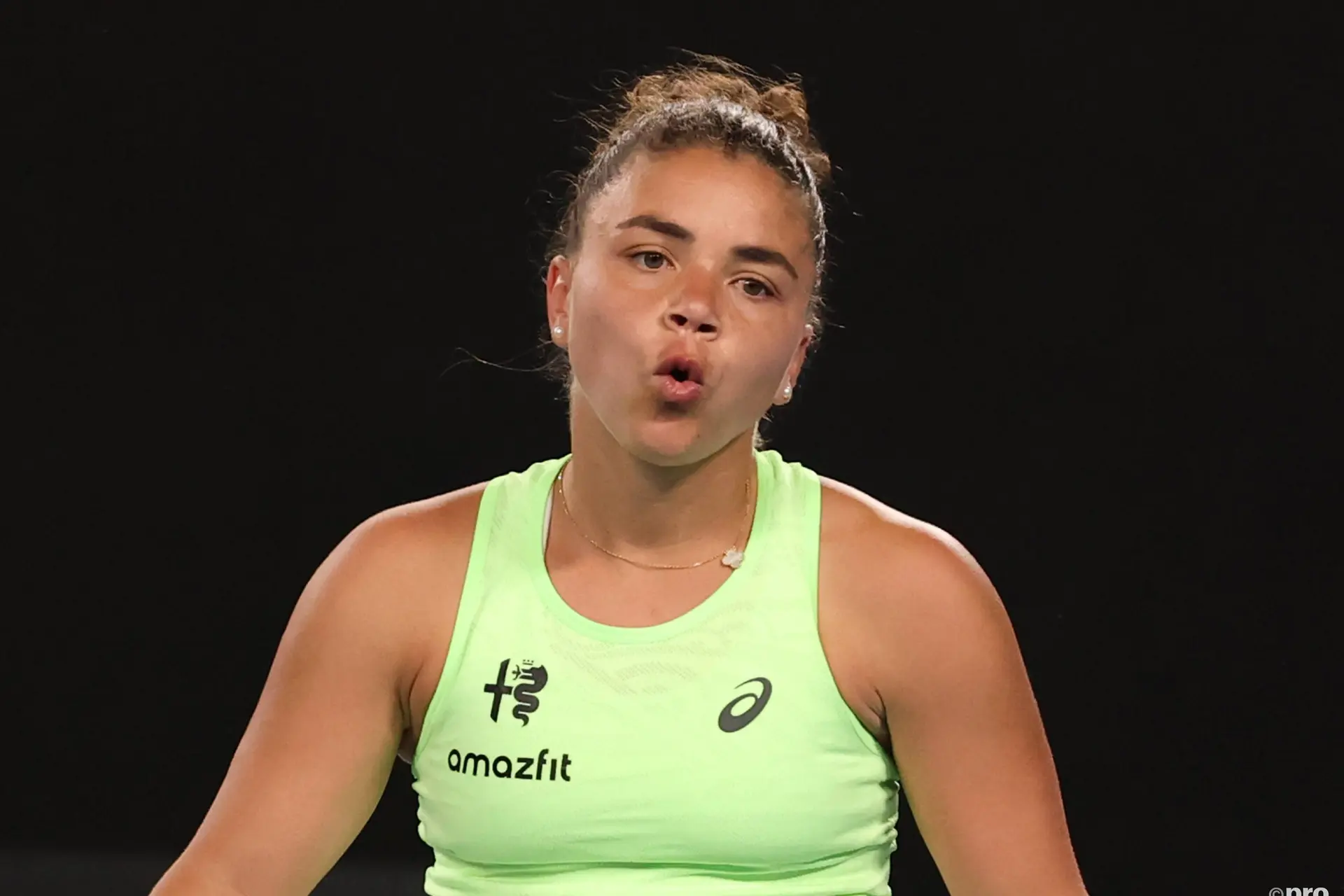Jasmine Paolini blows air.