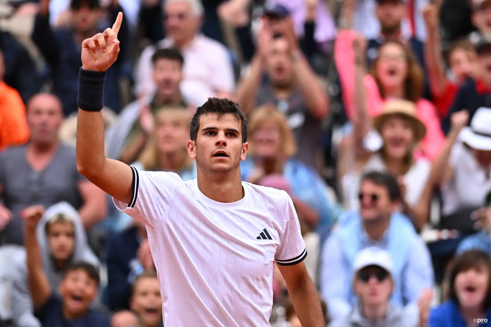 Rafael Jodar raises his right arm and points his finger to the sky while celebrating a point.