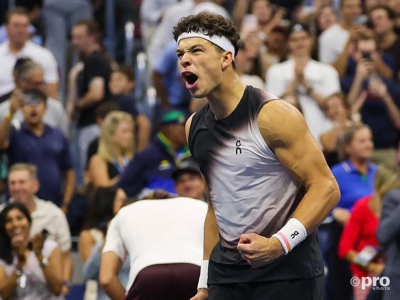 Ben Shelton celebrating on Arthur Ashe