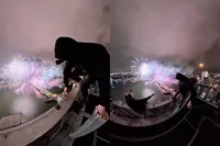 Levensgevaarlijk: op het dak van de Zalmhaventoren in Rotterdam heb je het mooiste uitzicht op het vuurwerk