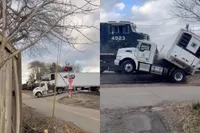 Vrachtwagen vast op spoor, trein doet wat treinen doen: trailer compleet naar de gallemiezen
