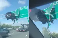 Auto hangt metershoog in snelwegbord… maar dit virale crashfilmpje is nep