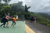 Paragliden in Brazilië gaat bijna gruwelijk mis: instructeur rolt van starthelling tijdens sprong
