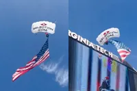 Parachuteshow gaat mis: skydiver blijft hangen in scorebord Virginia Tech
