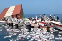 Containerschip zinkt in Straat van Hormuz en plotseling drijven er iPhones en dure parfums in zee