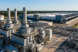 Hyperscale AI data center beside a large natural-gas power plant with turbines and electrical infrastructure.