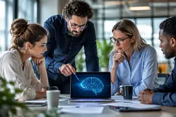 AI-geletterdheidstraining op de werkvloer: een team van professionals bespreekt verantwoord AI-gebruik rond een laptop in een moderne kantooromgeving.