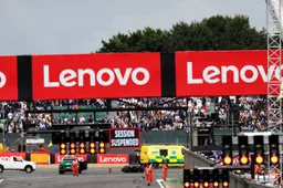 Protestors run onto the track during the race at Silverstone