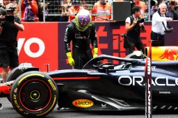 Hamilton stands watching Verstappen's RB20 after sprint race