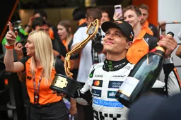 lando norris celebrates his 2025 f1 monaco grand prix win trophy in hand