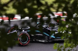 Formula 1 fans follow the action from hillside