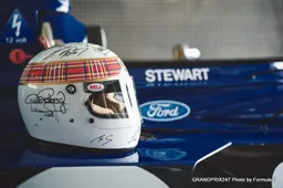 Michael Schumacher signs Jackie Stewart helmet for Bahrain show run
