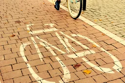 woman-riding-bicycle-path-centre-city
