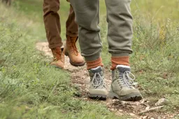 couple-s-feet-standing-trail