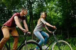 couple-bikes-young-happy-couple-cycling-outdoors