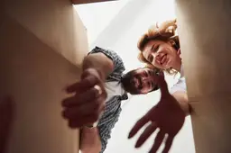 taking-clothes-from-box-happy-couple-together-their-new-house-conception-moving