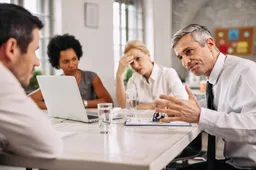angry-businessman-discussing-with-colleague-meeting-office