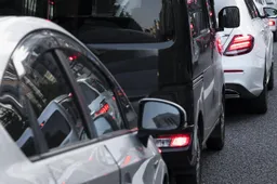 people-driving-cars-city-street