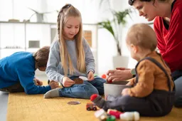 side-view-teacher-watching-kids-playing