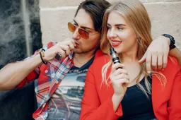 stylish-young-couple-with-vape-cafe