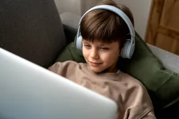 little-boy-watching-films-laptop