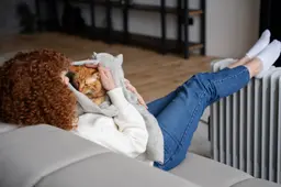 full-shot-woman-holding-cat-blanket
