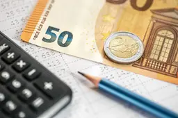 calculator-money-pencil-closeup-blurred-background