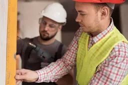 close-up-men-working-together-with-drill