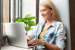 cute-young-woman-working-laptop