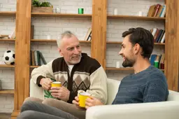 young-smiling-guy-aged-man-with-cups-settee