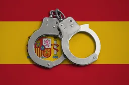 spain flag and police handcuffs 2022 11 14 16 26 37 utc