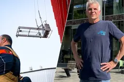 Glazenwasser Paul bungelt uur lang op 20 meter hoogte in hartje Rotterdam: ‘Het was wel even spannend’