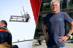 Glazenwasser Paul hangt uur lang op 20 meter hoogte in Rotterdam: ‘Het was wel even spannend’