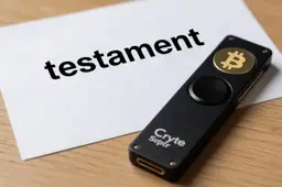 Een hardware wallet voor crypto ligt op tafel. ernaast een papier met 'testament' erboven