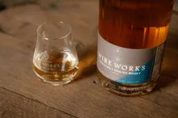 White Peak Necessary Evil Imperial Stour Cask finish whisky with glass