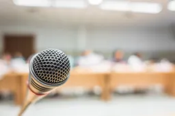 black-microphone-conference-room-filtered-image-processed-v