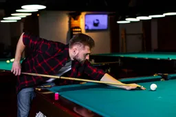 medium-shot-guy-playing-billiard