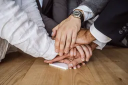 united-hands-business-team-workspace-background